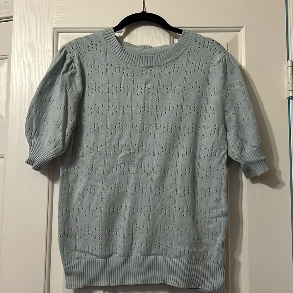 Size large, light blue sweater. Very light soft material. Fitted large.